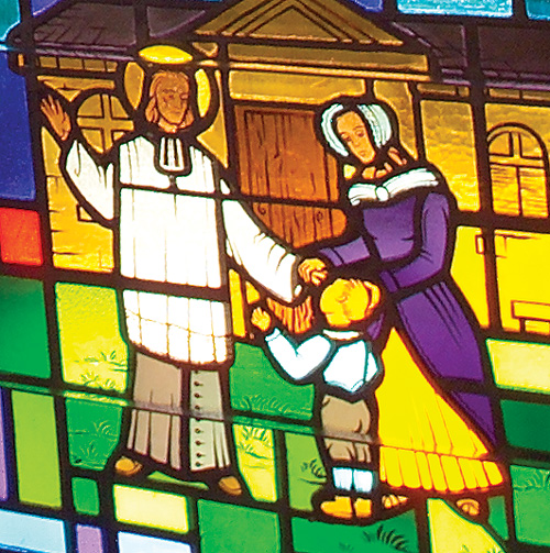 St. John Vianney Blesses an Orphan - Detail of Stained Glass Window at Saint John Vianney Church, Johnstown, PA
